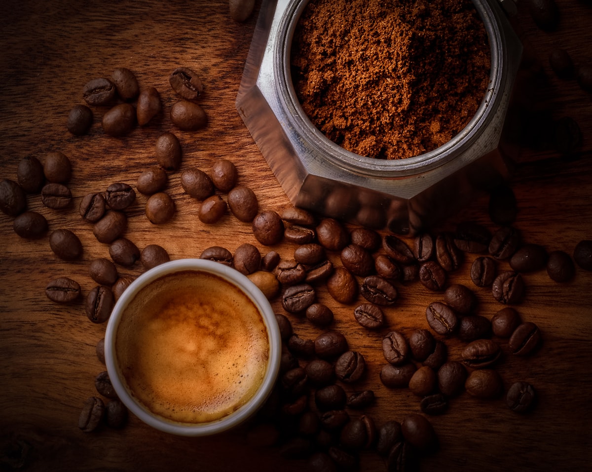 Coffee beans and a fresh cup of coffee
