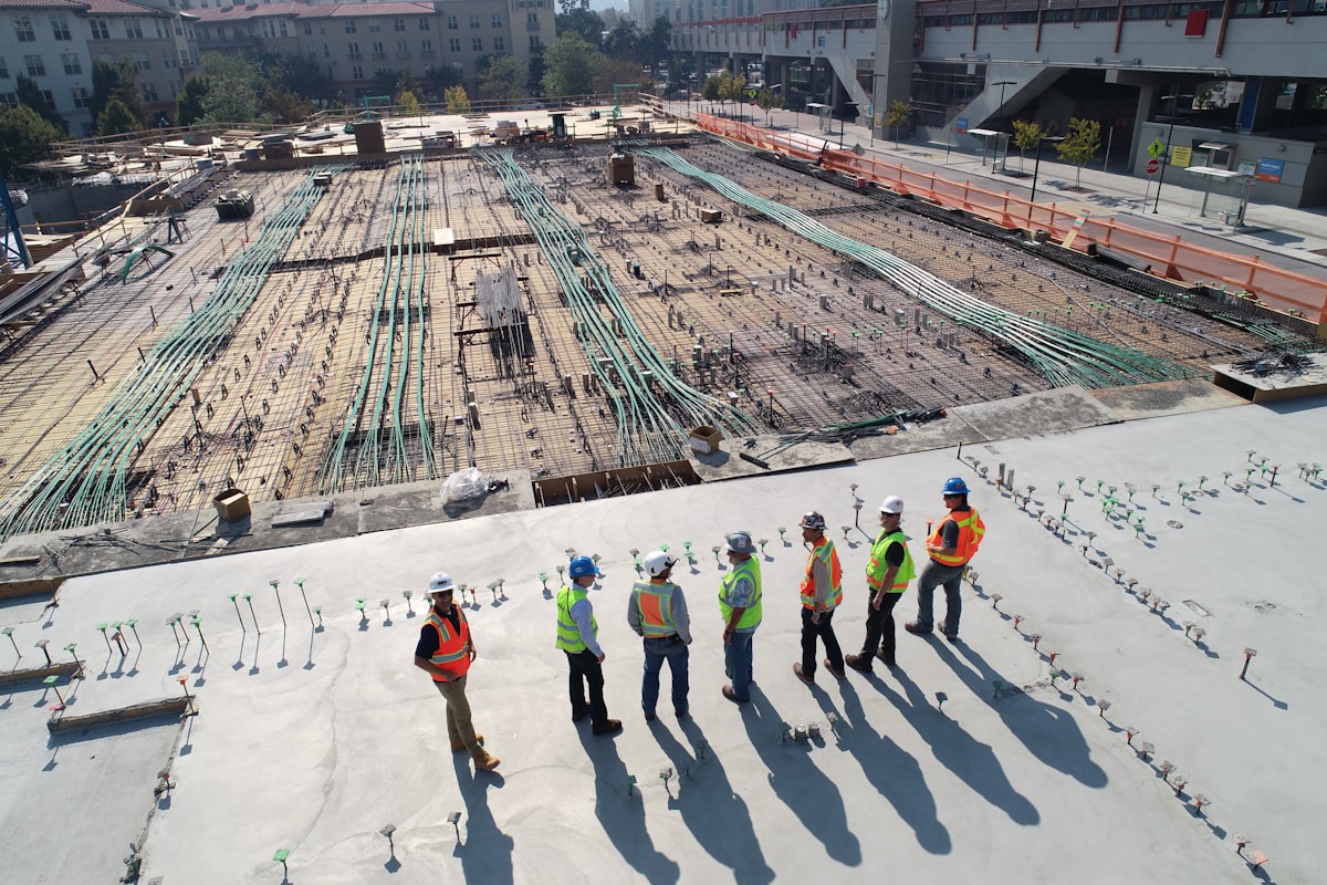 Construction crew surveying a building site